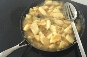 cooked apple in pan