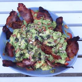 guacamole with bacon and seeds