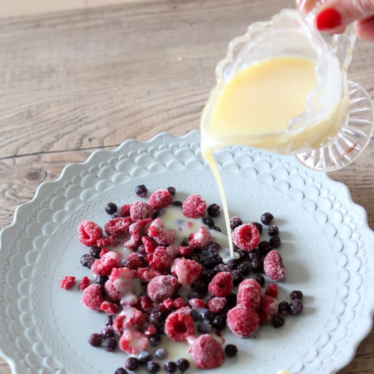frozen berries with white chocolate sauce